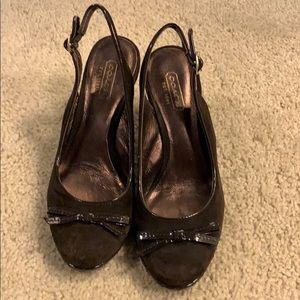 Brown suede coach wedges.